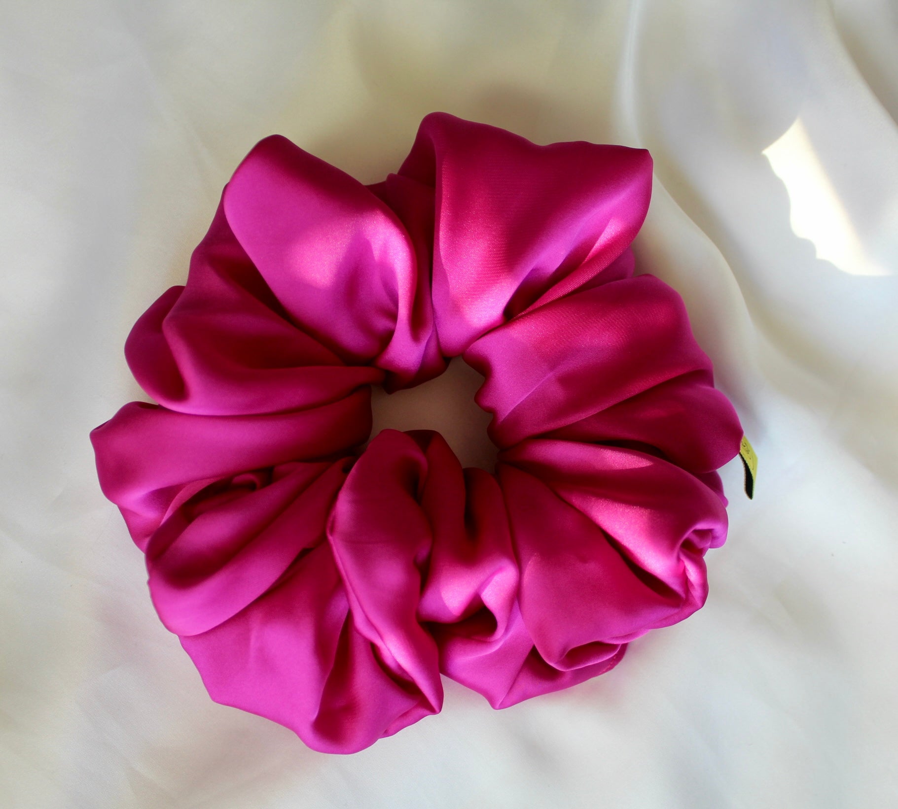 This is a luxurious fuscia bright pink satin hair scrunchie they are perfect for any elegant hairstyle,they will hold your hair in place without pulling on your roots preventing hair loss.Making them perfect for anyone who has a sensitive scalp or chronic illness.