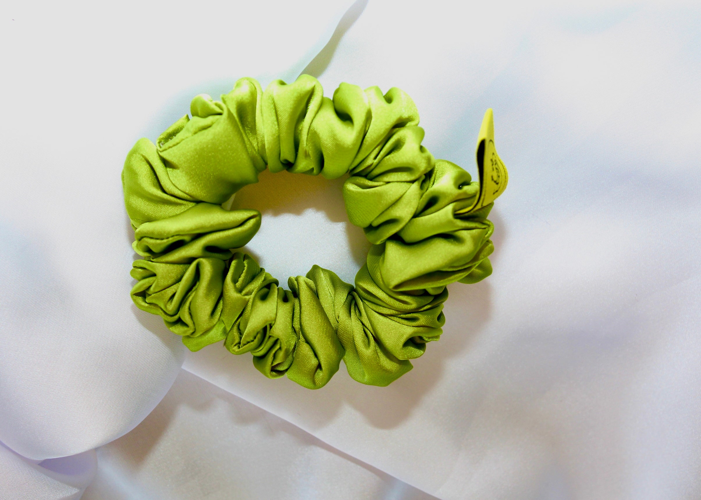 This is a luxurious Lime green satin hair scrunchie they are perfect for any elegant hairstyle,they will hold your hair in place without pulling on your roots preventing hair loss.Making them perfect for anyone who has a sensitive scalp or chronic illness.