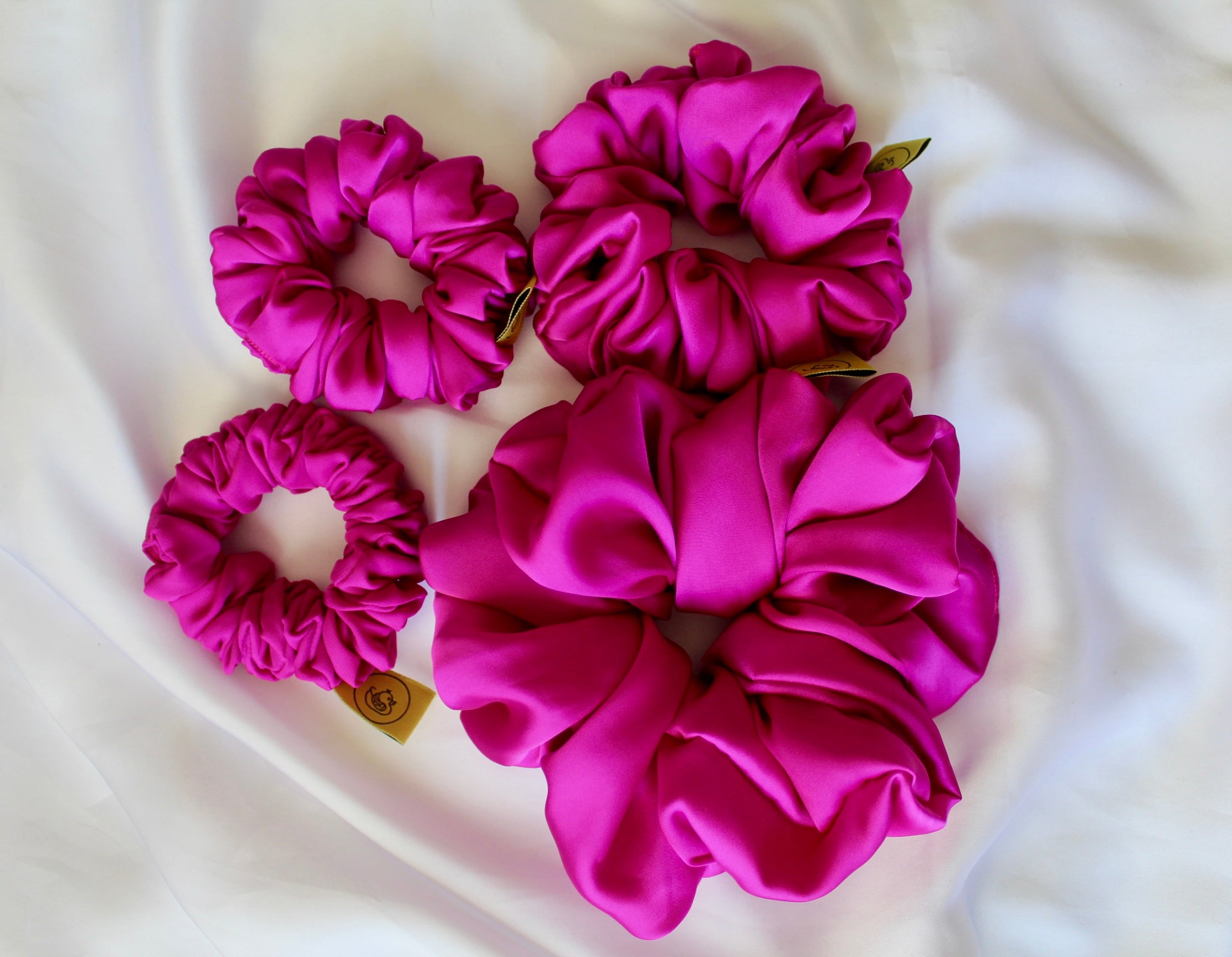 This is a luxurious fuscia bright pink satin hair scrunchie they are perfect for any elegant hairstyle,they will hold your hair in place without pulling on your roots preventing hair loss.Making them perfect for anyone who has a sensitive scalp or chronic illness.