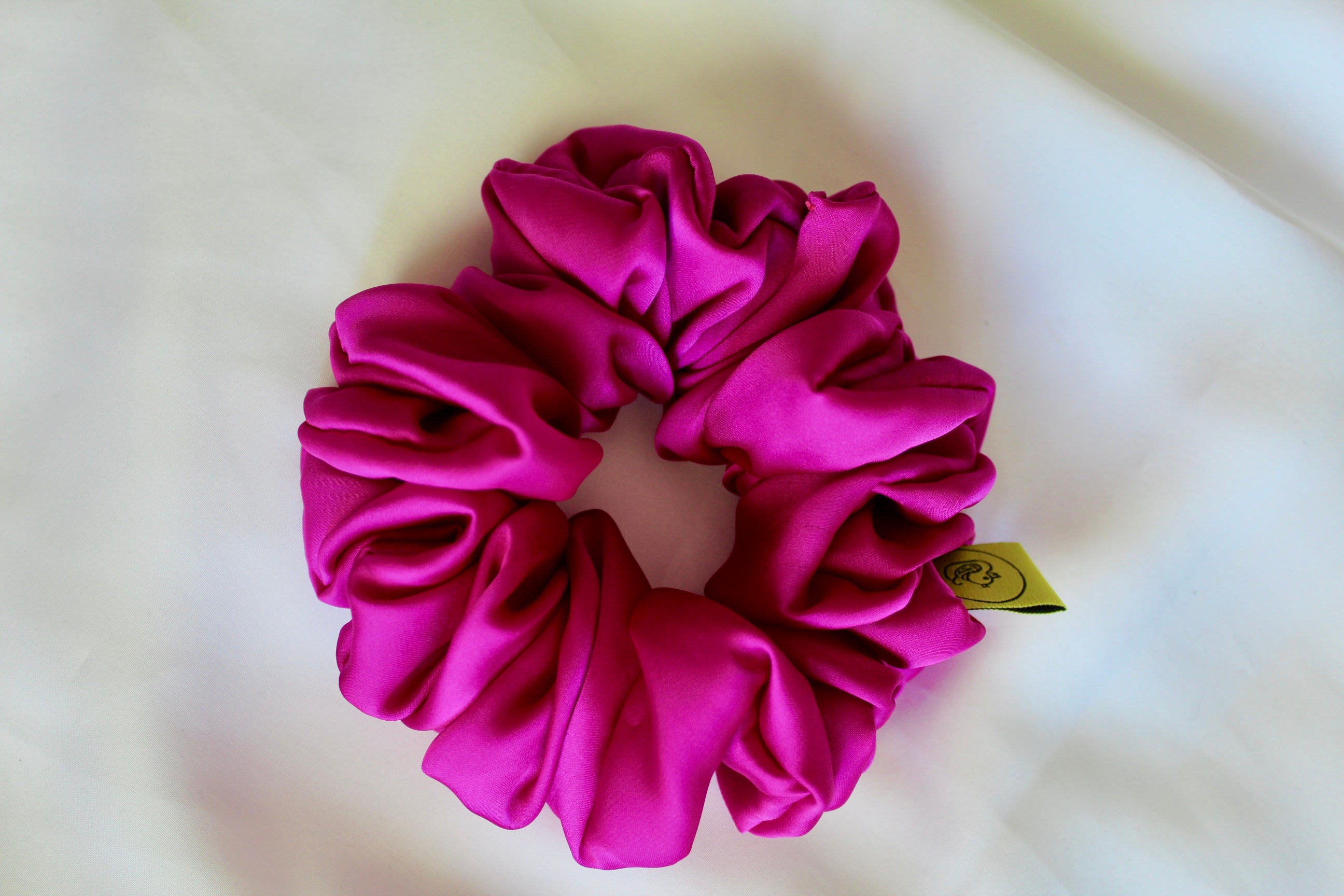 This is a luxurious fuscia bright pink satin hair scrunchie they are perfect for any elegant hairstyle,they will hold your hair in place without pulling on your roots preventing hair loss.Making them perfect for anyone who has a sensitive scalp or chronic illness.