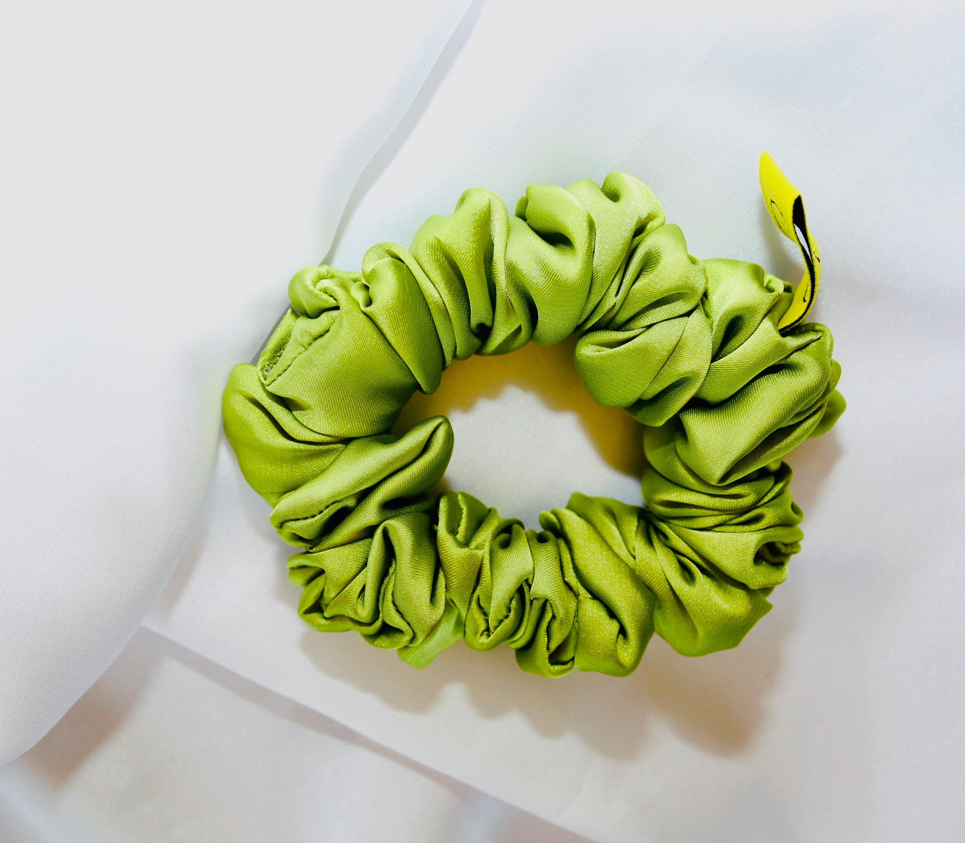 This is a luxurious Lime Green satin hair scrunchie they are perfect for any elegant hairstyle,they will hold your hair in place without pulling on your roots preventing hair loss.Making them perfect for anyone who has a sensitive scalp or chronic illness.