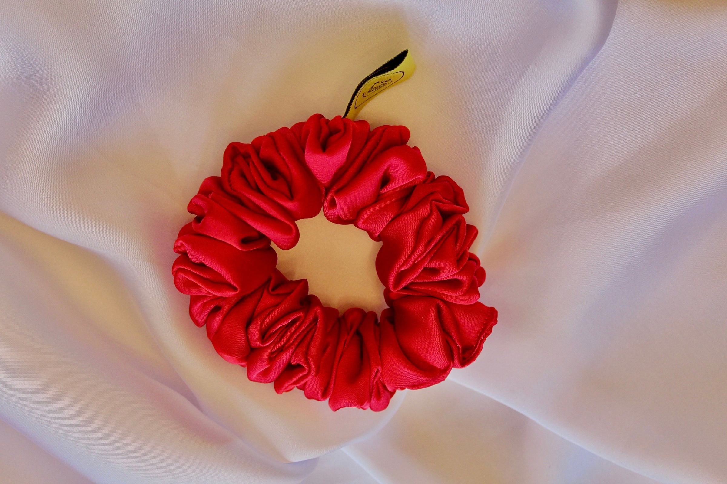 This is a luxurious red satin hair scrunchie they are perfect for any elegant hairstyle,they will hold your hair in place without pulling on your roots preventing hair loss.Making them perfect for anyone who has a sensitive scalp or chronic illness.