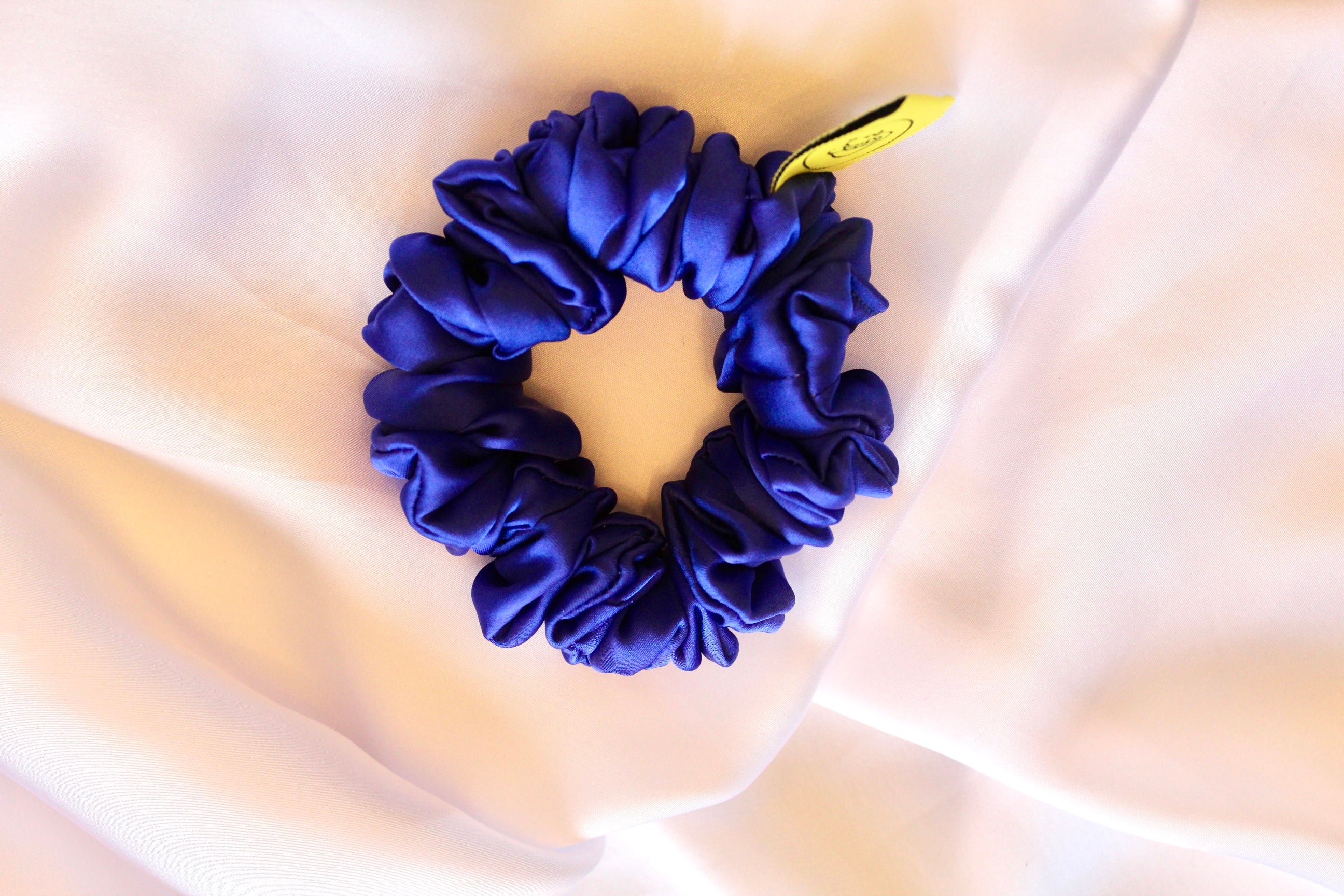 This is a luxurious Royal Blue satin hair scrunchie they are perfect for any elegant hairstyle,they will hold your hair in place without pulling on your roots preventing hair loss.Making them perfect for anyone who has a sensitive scalp or chronic illness.