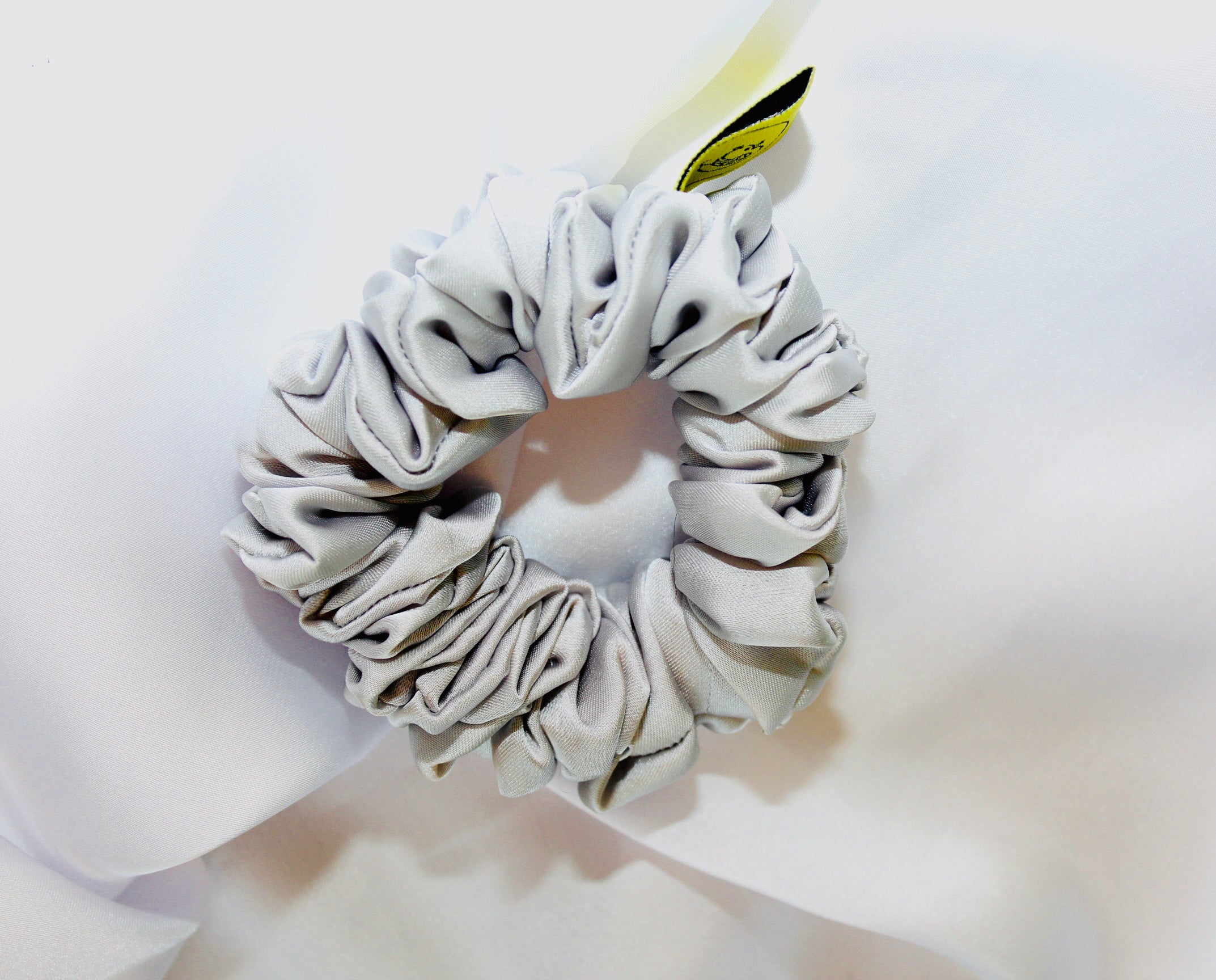 This is a luxurious Silver satin hair scrunchie they are perfect for any elegant hairstyle,they will hold your hair in place without pulling on your roots preventing hair loss.Making them perfect for anyone who has a sensitive scalp or chronic illness.